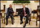 President George W. Bush welcomes Prime Minister Tillman Thomas of Grenada to the Oval Office Wednesday, Oct. 8, 2008, at the White House. White House photo by Eric Draper