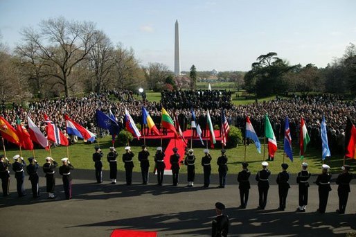 President George W. Bush addresses a crowd gathered on the South Lawn to celebrate the induction of seven countries into NATO Monday, March 29, 2004. The countries acceding to the alliance are Latvia, Slovenia, Lithuania, the Slovak Republic, Romania, Bulgaria and Estonia. White House photo by Susan Sterner