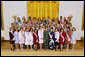 Mrs. Laura Bush poses with the 2004 Cherry Blossom Princesses in the East Room Wednesday, March 31, 2004. White House photo by Paul Morse