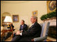 President George W. Bush and United Nations Secretary General Ban Ki-moon address members of the media in the Oval Office Tuesday, July 17, 2007, offering a short summary of their discussions on the issues of Darfur, plans for an upcoming Middle East conference, and UN plans in Afghanistan and Iraq. White House photo by Eric Draper