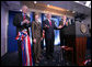 President George W. Bush and Mrs. Laura Bush, with White House Press Secretary Tony Snow, left, welcome reporters and photographers back to the newly re-modeled James S. Brady Press Briefing Room following an official ribbon cutting, Wednesday, July 11, 2007, at the White House. White House Correspondents' Association president Steve Scully is seen at right. White House photo by Eric Draper