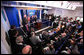 President George W. Bush and Mrs. Laura Bush participate in the ribbon-cutting ceremony to officially open the newly renovated James S. Brady Press Briefing Room Wednesday morning, July 11, 2007, at the White House. White House photo by Eric Draper