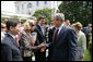 President George W. Bush greets Eunice Kennedy Shriver, the founder of Special Olympics, during a Special Olympics Global Law Enforcement Torch Run Ceremony Thursday, July 26, 2007, in the Rose Garden. The Special Olympics Law Enforcement Torch Run was begun in 1981 in Wichita, Kansas, by Police Chief Richard LaMunyon. Since then the torch run has expanded to all 50 states and 35 nations. This years marks the first Global Special Olympics Law Enforcement Torch Run. White House photo by Eric Draper