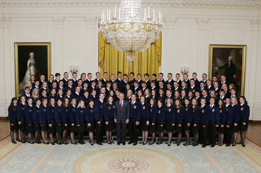 President George W. Bush joins the National and State Future Farmers of America organization members for photo Thursday, July 26, 2007, in the East Room of the White House. The mission of the FFA is to help students develop their potential for leadership, personal growth and career success through agricultural education. White House photo by Joyce N. Boghosian
