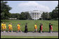 Law enforcement runners and supporters walk with Special Olympic athletes on the South Lawn after attending a Special Olympics Global Law Enforcement Torch Run Ceremony Thursday, July 26, 2007, in the Rose Garden. White House photo by David Bohrer