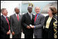 President George W. Bush presents the Congressional Gold Medal to Tuskegee Airman Earl Middleton Tuesday, July 24, 2007, joined by Middleton’s son, Kenny; South Carolina Senator Lindsey Graham, left, and Middleton family friend Joy Barnes, right, at the Charleston AFB in Charleston, S.C. White House photo by Eric Draper