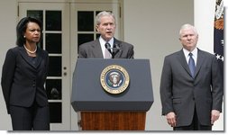 Flanked by U.S. Secretary of State Condoleezza Rice and U.S. Secretary of Defense Robert Gates, President George W. Bush delivers a statement in the Rose Garden Wednesday, Aug. 13, 2008, regarding efforts by the United States to resolve the crisis in Georgia. White House photo by Joyce N. Boghosian