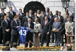 President George W. Bush is embraced by Indianapolis Colts’ quarterback Peyton Manning, left, and coach Tony Dungy during a ceremony honoring their victory in the 2007 NFL Super Bowl Monday, April 23, 2007, on the South Lawn. White House photo by Shealah Craighead