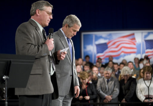 President George W. Bush bows his head Thursday, April 19, 2007, as Steve Bruns, President Emeritus of the Tipp City (Ohio) Chamber of Commerce, extends a moment of silence in memory of those killed in Monday's shootings at Virginia Tech. The President visited Ohio to deliver remarks on the global war on terror. White House photo by Eric Draper