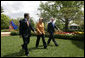 President George W. Bush and European Council President Angela Merkel of Germany, and European Commission President Jose Manuel Barroso of Portugal leave the Rose Garden Monday, April 30, 2007, after their joint press conference. White House photo by Eric Draper