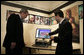 President George W. Bush watches a demonstration of Google Earth by Larry Swaider, Chief Information Officer for the U.S. Holocaust Memorial Museum, during his visit Wednesday, April 18, 2007. The President visited two exhibits and delivered remarks commemorating the Holocaust Days of Remembrance. White House photo by Eric Draper