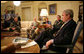 President George W. Bush delivers a statement on the War in Iraq during a visit Monday, April 23, 2007, by Gen. David Petraeus, Commander of the Multinational Force-Iraq, to the White House. Said the President, "I will strongly reject an artificial timetable withdrawal and/or Washington politicians trying to tell those who wear the uniform how to do their job." With them is Gen. Peter Pace, Chairman of the Joint Chiefs of Staff, left, and Gordon England, Deputy Secretary of Defense. White House photo by Eric Draper