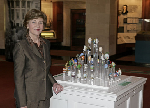 Mrs. Laura Bush stands next to 51 State Eggs decorated by artists from each state and the District of Columbia Tuesday, April 3, 2007, at the White House Visitor Center in Washington, D.C. The tradition of the State Egg Display for Easter began in 1994. Each year the artists vote amongst themselves to select the artist to create the following year’s commemorative egg which is presented to the President and First Lady. White House photo by Shealah Craighead