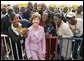 Laura Bush poses with U.S. Embassy workers and their family members, Wednesday, Jan. 18, 2006, during a stop at the U.S. Embassy in Abuja, Nigeria. White House photo by Shealah Craighead