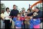 Laura Bush attends a ribbon cutting ceremony with football star Brett Favre and his wife, Deanna, left, Secretary Margaret Spelling, center, Dan Vogel, Associate Director, USA Fredom Corps, right, and student of Hancock North Central Elementary Shool at the Kaboom Playground, built at the Hancock North Central Elementary School in Kiln, Ms., Wednesday, Jan. 26, 2006, during a visit to the area ravaged by Hurricane Katrina. White House photo by Shealah Craighead