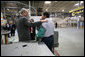 President George W. Bush greets an employee of Wright Manufacturing, Inc., Friday, Jan. 18, 2008, during his visit to the Frederick, Maryland business. White House photo by Joyce N. Boghosian