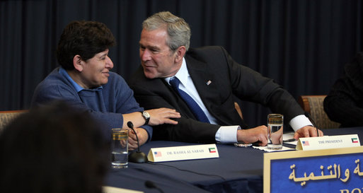 President George W. Bush leans toward Dr. Rasha Al Sabah, Kuwait's Undersecretary for Higher Education, during a roundtable discussion in Kuwait City, Saturday, Jan. 12, 2008, on democracy and development with Kuwaiti women. White House photo by Eric Draper