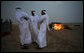 Guests mingle near open fires in the desert near Abu Dhabi Sunday, Jan. 13, 2008, during a dinner with President George W. Bush and Crown Prince Sheikh Mohammed bin Zayed Al Nayhan. White House photo by Eric Draper