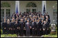 President George W. Bush poses with the United States Naval Academy football team during the presentation of the Commander-in-Chief Trophy in the Rose Lawn April 25, 2006. "Seniors on this team have lead one of the most dramatic turn-arounds in college football history," said the President. "Navy has won 26 games in the past three seasons after winning just three games during the previous three years. The seniors are the sixth class in Academy history to have beaten Army all four years." White House photo by Kimberlee Hewitt