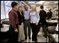 President George W. Bush spends time with Marines and their families following lunch inside the mess hall at the Marine Corps Air Ground Combat Center in Twentynine Palms, California, Sunday, April 23, 2006. White House photo by Eric Draper