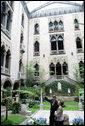 Stan Kozak, Chief Horticulturist of the Gardner Museum, guides Mrs. Laura Bush though a tour of the interior courtyard garden, Tuesday, April 24, 2006, during a visit to the Isabella Stewart Gardner Museum in Boston. The museum is modeled after a 15th century Venetian Palazzo, turned inside out and surrounding the courtyard. White House photo by Shealah Craighead