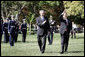 Presidents George W. Bush and Hu Jintao wave to guests gathered on the South Lawn of the White House to celebrate the arrival of the Chinese President, Thursday, April 20, 2006. White House photo by Eric Draper