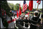 Flags are raised high as President George W. Bush and Mrs. Laura Bush make their way from the White House South Portico to participate in the South Lawn Arrival Ceremony for Chinese President Hu Jintao, Thursday, April 20, 2006. White House photo by David Bohrer