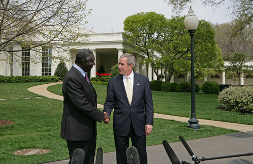 After meeting in the Oval Office,President George W. Bush and President John Kufuor of Ghana shake hands during a joint statement to the press on the South Lawn Wednesday, April 12, 2006. "We just had a wonderful discussion about our bilateral relations, and a great discussion about the world. I really enjoy talking to a man of vision and strength and character. President Kufuor has done a fantastic job for Ghana," said President Bush. "He's told the people of his country he'd bring honesty to government, and he has. He told the people of his country that he would work to create a stable economic platform for -- and he has done that, as well. And he's a man of peace. He cares deeply about peace in the region." White House photo by Kimberlee Hewitt