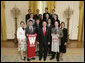 President George W. Bush stands with members of the University of Wisconsin Men’s Cross Country Team Thursday, April 6, 2006, during a photo opportunity with the 2005 and 2006 NCAA Sports Champions. White House photo by Paul Morse