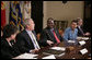 President George W. Bush meets with Darfur advocates, including former slave Simon Deng, in the Roosevelt Room Friday, April 28, 2006. "I just had an extraordinary conversation with fellow citizens from different faiths, all of who have come to urge our government to continue to focus on saving lives in Sudan," said the President to the press. "They agree with thousands of our citizens -- hundreds of thousands of our citizens -- that genocide in Sudan is unacceptable." White House photo by Paul Morse