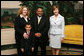 Mrs. Laura Bush poses for a photo with Sal Tinajero, his wife Jennifer and son Salvador, Thursday, April 6, 2006, in the Diplomatic Room at the White House. Mr. Tinajero, a high school teacher in Santa Ana, CA, is the recipient of Hispanic Magazine's Teacher of the Year award, which recognizes him as a single outstanding educator within the Hispanic community by means of motivating, inspiring and preparing his students for a promising future. White House photo by Shealah Craighead