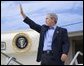 President George W. Bush waves from Air Force One before departing Las Vegas-McCarran International Airport in Nevada, Thursday, Aug. 12, 2004. White House photo by Eric Draper