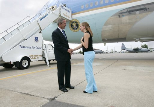 President George W. Bush meets Freedom Corps greeter Andrea Martin in front of Air Force One at Nashville International Airport-Tennessee Air National Guard, Tuesday, Aug. 31, 2004. Martin, 21, volunteers with Mercy Ministries, a non-profit, faith-based ministry for girls aged 13 to 28 who are struggling with drug and alcohol abuse, unplanned pregnancies, eating disorders, abuse, or suicidal tendencies. White House photo by Eric Draper.