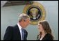 President George W. Bush talks with Freedom Corps Greeter Amy Bickel in front of Air Force One at Des Moines International Airport-Air National Guard Base, Tuesday, Aug. 31, 2004. Bickel co-founded the Central Iowa Young Women’s Leadership Institute to help high school girls develop strong leadership skills and a commitment to community service. White House photo by Eric Draper.