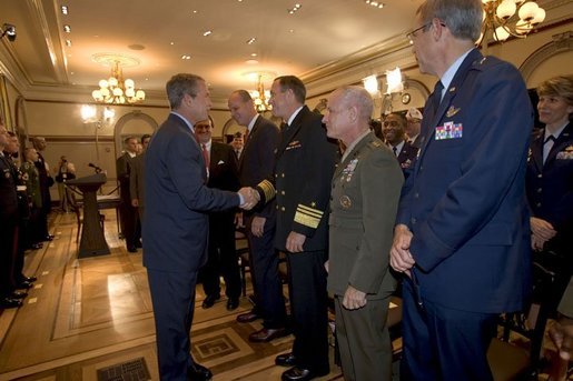 President George W. Bush greets military personnel after signing H.R.4613, The Defense Appropriations Act for Fiscal Year 2005, in the Dwight D. Eisenhower Executive Office Building Thursday, Aug. 5, 2004. White House photo by Eric Draper