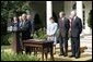 President George W. Bush delivers remarks during the signing ceremony of H.R. 4759, The United States-Australia Free Trade Agreement Implementation Act in the Rose Garden Tuesday, Aug. 3, 2004. "It expands our security and political alliance by creating a true economic partnership. It will create jobs and opportunities," said President Bush.