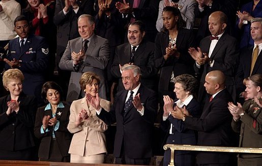Mrs. Bush applauds her special guest, Dr. Adnan Pachachi, President of the Iraqi Governing Council, during President Bush's State of the Union Address at the U.S. Capitol Tuesday, Jan. 20, 2004. "Sir, America stands with you and the Iraqi people as you build a free and peaceful nation," said the President in his acknowledgement of Dr. Pachachi. White House photo by Paul Morse