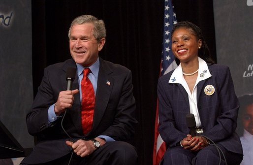 President George W. Bush discusses the No Child Left Behind Act at Pierre Laclede Elementary School with Principal Yolanda Moss and other faculty members in St. Louis, Mo., Monday, Jan. 5, 2004. "This school is a school that has performed -- you have to say, brilliantly," said President Bush of Lacledes' raising the grade level reading of third grade students from 7 percent in 1999 to 80 percent today. "That speaks to strong principals, it speaks to really good teachers. It says this school has got teachers that believe in the capability of every child. It says the school has raised standards and is not afraid to measure." White House photo by Tina Hager