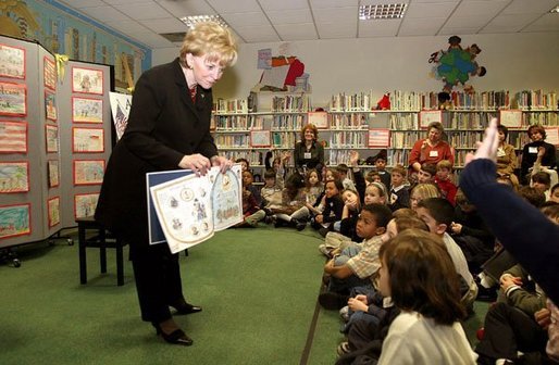 Students at Vincenza Elementary School listen as Lynne Cheney reads her book "America: A Patriotic Primer" during her visit to Caserma Ederle in Vicenza, Italy, Jan. 27, 2004. White House photo by David Bohrer.