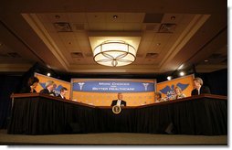 President George W. Bush joins U.S. Secretary of Health & Human Services, Mike Leavitt, left, and Minnesota health care professionals in a panel discussion Tuesday, Aug. 22, 2006, at the Minneapolis Marriott Southwest in Minnetonka, Minn., to offer perspectives on efforts to enhance health care transparency and move towards a value-based health care competition.  White House photo by Paul Morse