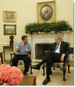 President George W. Bush shares a moment with Rockey Vaccarella Wednesday, Aug. 23, 2006, in the Oval Office of the White House. The St. Bernard Parish resident who drove from Louisiana to meet with the President said "I wanted to thank President Bush for the millions of FEMA trailers that were brought down there." He added, ". I just don't want the government and President Bush to forget about us." White House photo by Paul Morse