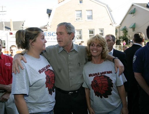 President George W. Bush talks with residents of Millvale, Pa. at the Millvale Fire Department during a visit to the area recently flooded by Tropical Depression Ivan in Allegheny County, Pa., Wednesday, Sept. 22, 2004. White House photo by Eric Draper.