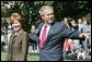 President George W. Bush and Laura Bush wave before departing the South Lawn on Marine One Thursday, Sept. 9, 2004. White House photo by Paul Morse.