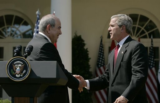 President George W. Bush shakes hands with Iraqi interim Prime Minister Ayad Allawi after their joint press conference in the Rose Garden Thursday, Sept. 23, 2004. White House photo by Paul Morse