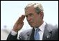 President George W. Bush salutes a graduating cadet at the United States Air Force Academy Graduation Ceremony in Colorado Springs, Colorado, June 2, 2004. White House photo by Eric Draper.