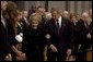 President George W. Bush escorts former First Lady Nancy Reagan to her seat before the funeral service for former President Ronald Reagan at the National Cathedral in Washington, DC on June 11, 2004. White House photo by Paul Morse.