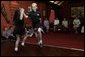 Laura Bush watches traditional Irish dancing during a children’s performance at Dromoland Castle with, from left, Susie Evans, Marna Schnabel and Margaret Kenny in Shannon, Ireland, Saturday, June 26, 2004. White House photo by Joyce Naltchayan