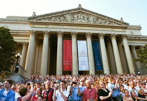 Thousands of people paid tribute to former President Ronald Reagan as they view his funeral procession along Constitution Avenue, Wednesday, June 9, 2004. White House photo by Joyce Naltchayan.