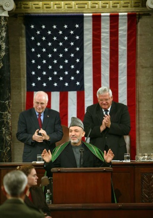 Vice President Dick Cheney and Speaker of the House Dennis Hastert (R-IL), right, welcome Afghanistan President Hamid Karzai, center, before he addresses the joint meeting of Congress on Capitol Hill Tuesday, June 15, 2004. White House photo by David Bohrer.