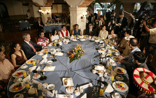 President George W. Bush joins a breakfast meeting with Training, Internships and Scholarships (TIES) recipients Wednesday, March 14, 2007, in Merida, Mexico. White House photo by Eric Draper